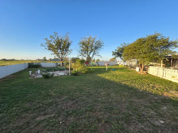 a view of a house with a big yard