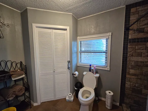 a large kitchen with a table and chairs