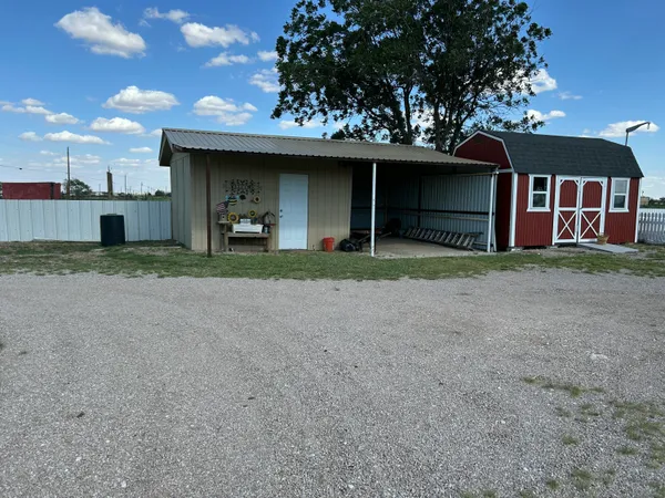 a view of a house with a yard and garage