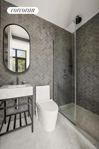 a bedroom with a bed and glass window