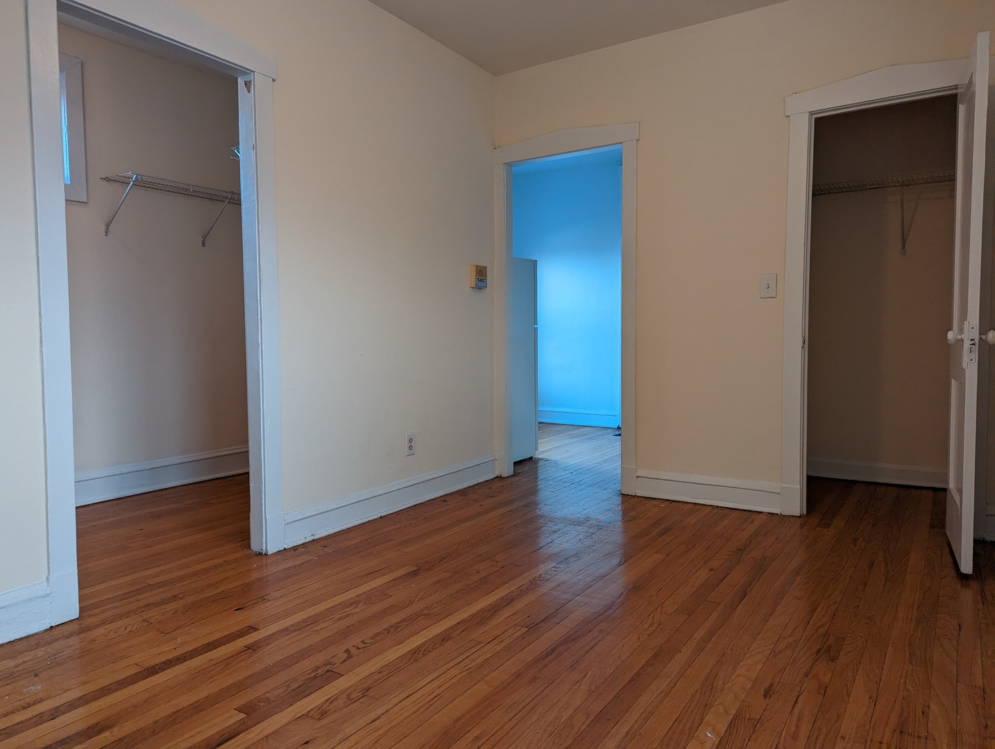 2649.5 North Spaulding Avenue, Unit 1S Chicago, IL 60647 - Photo 4 of 10 a view of an empty room with wooden floor and closet