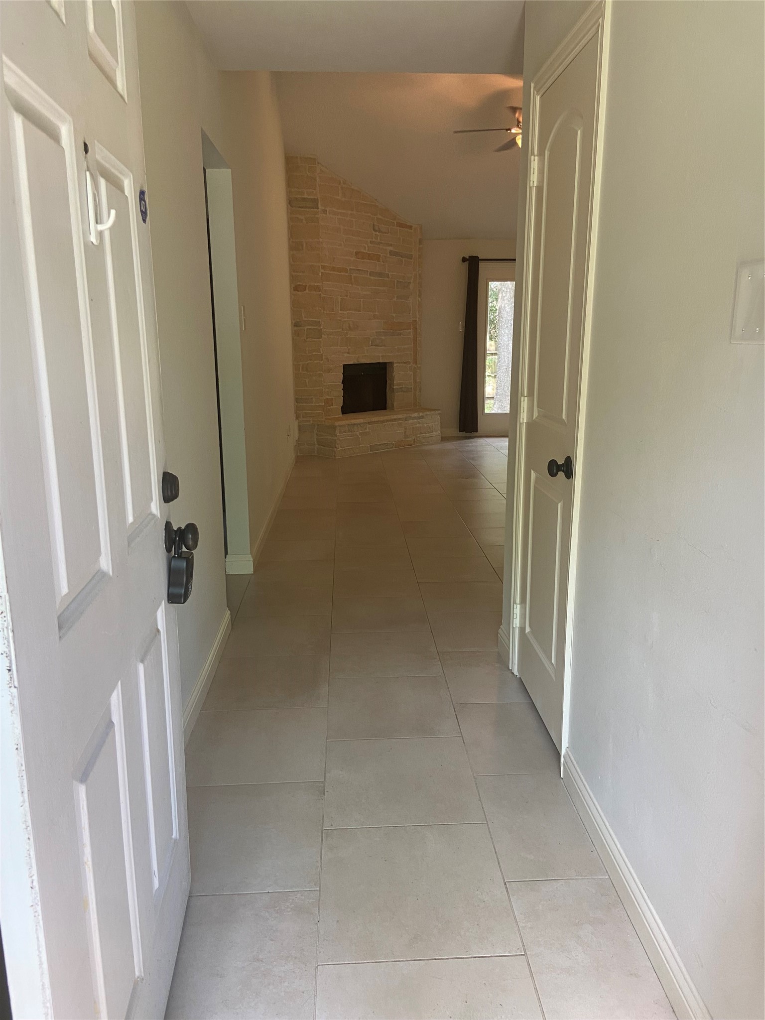 60 Oldstream Court Spring, TX 77381 - Photo 2 of 9 a view of a hallway with wooden floor and staircase