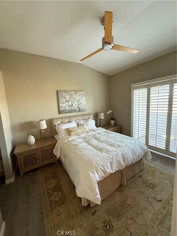 a spacious bedroom with a bed and a couch