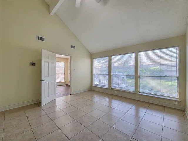 a view of an empty room and window