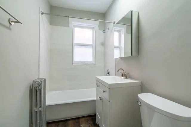 a bathroom with a sink toilet and tub