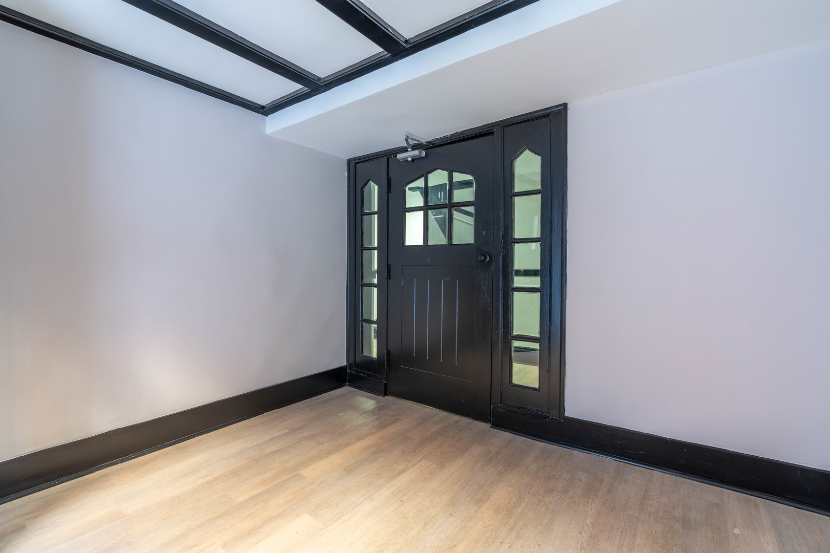 7420 North Damen Avenue, Unit 1F Chicago, IL 60645 - Photo 4 of 18 a view of an empty room with a window