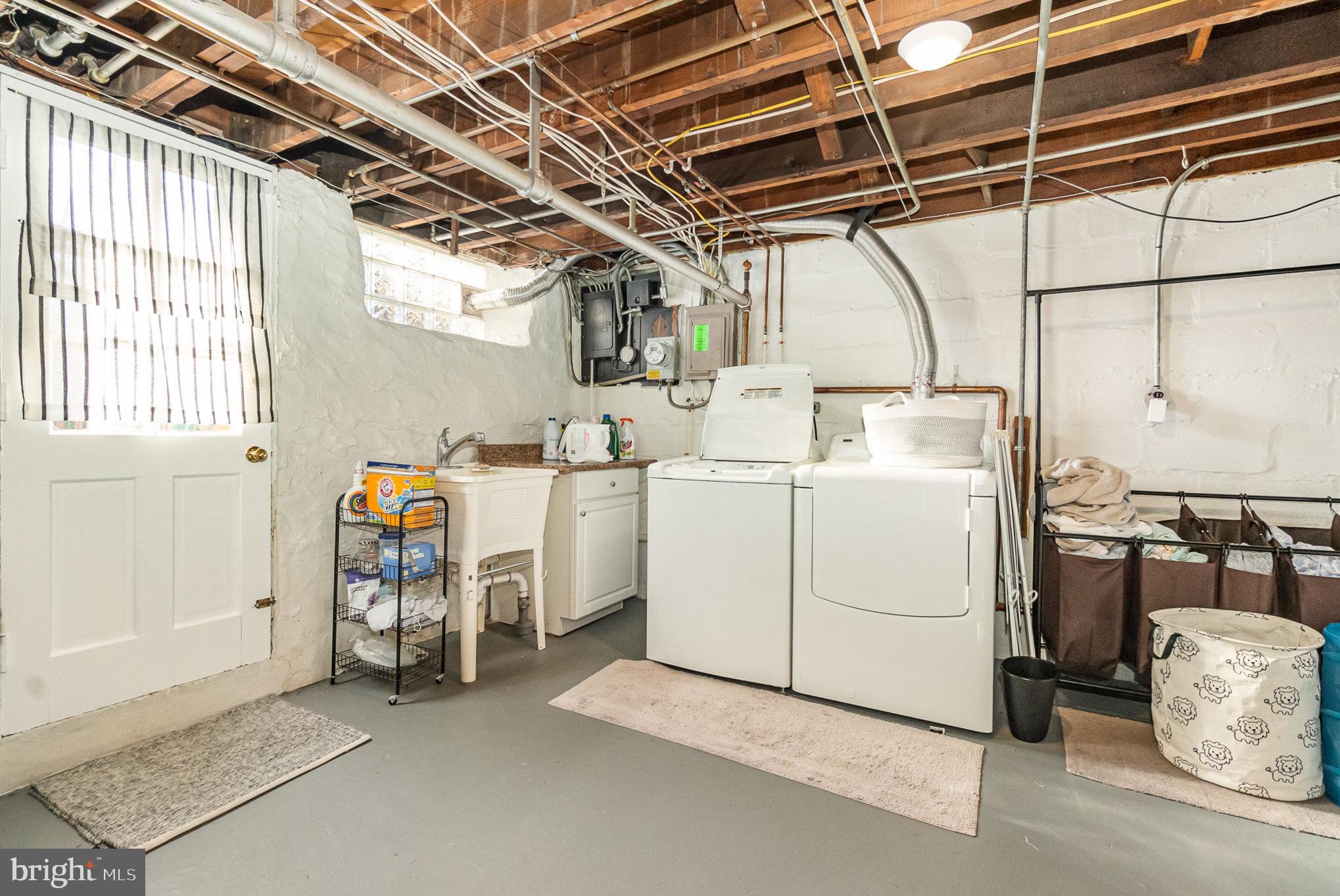 1221 Roundhill Road Baltimore, MD 21218 - Photo 31 of 47 Laundry Room with access to rear yard