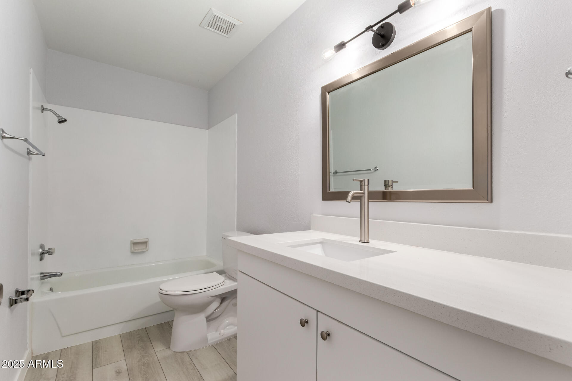 716 West Boxelder Place Chandler, AZ 85225 - Photo 11 of 15 a bathroom with a sink a toilet and shower