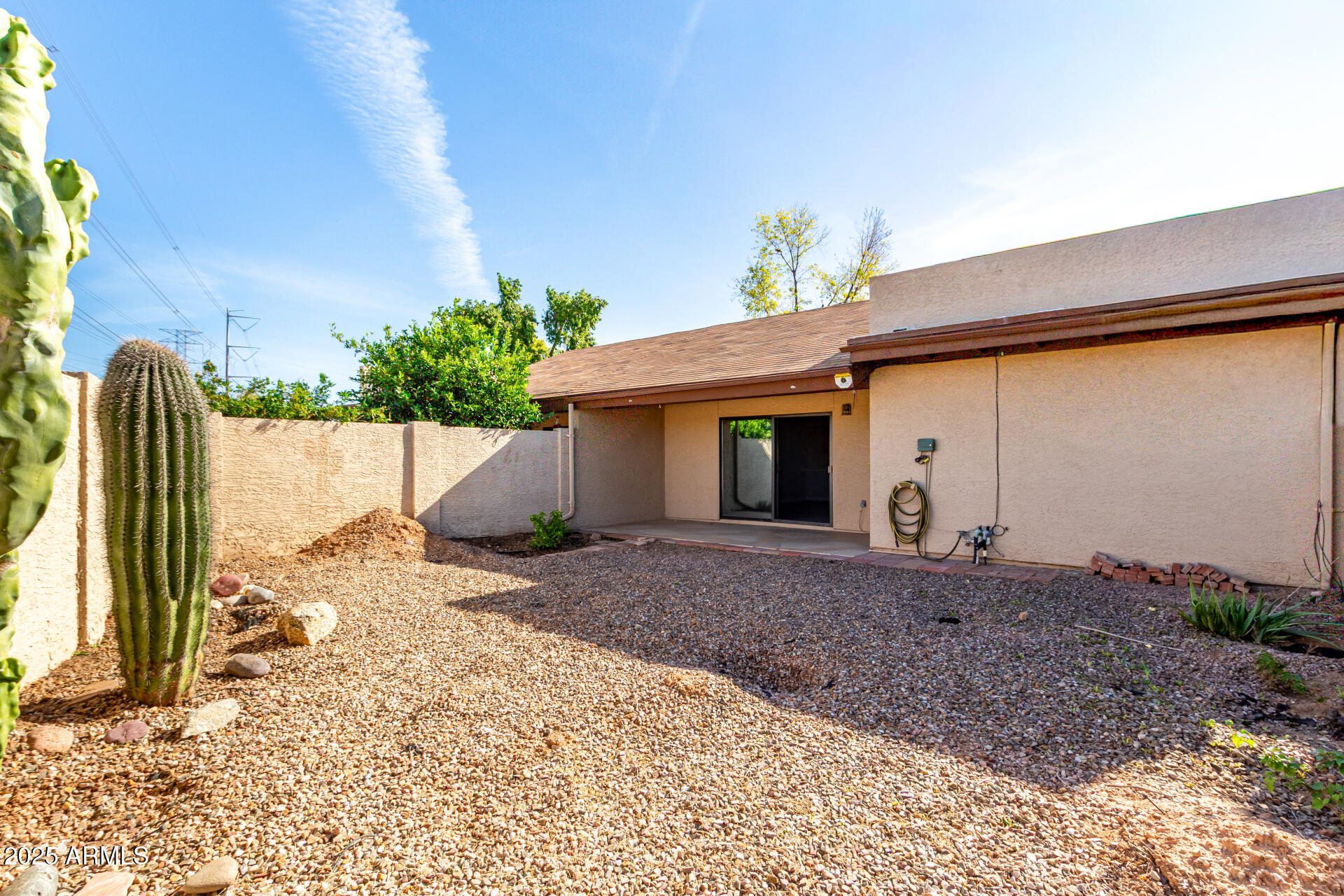 716 West Boxelder Place Chandler, AZ 85225 - Photo 15 of 15 a view of a house with a backyard and a garage