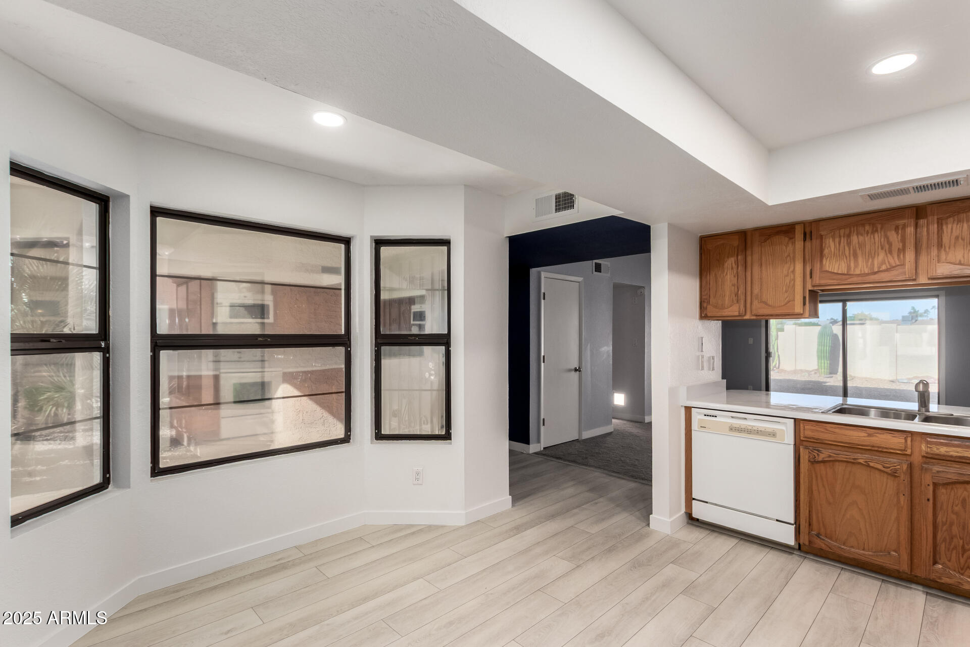 716 West Boxelder Place Chandler, AZ 85225 - Photo 3 of 15 a kitchen with stainless steel appliances a stove top oven and a refrigerator