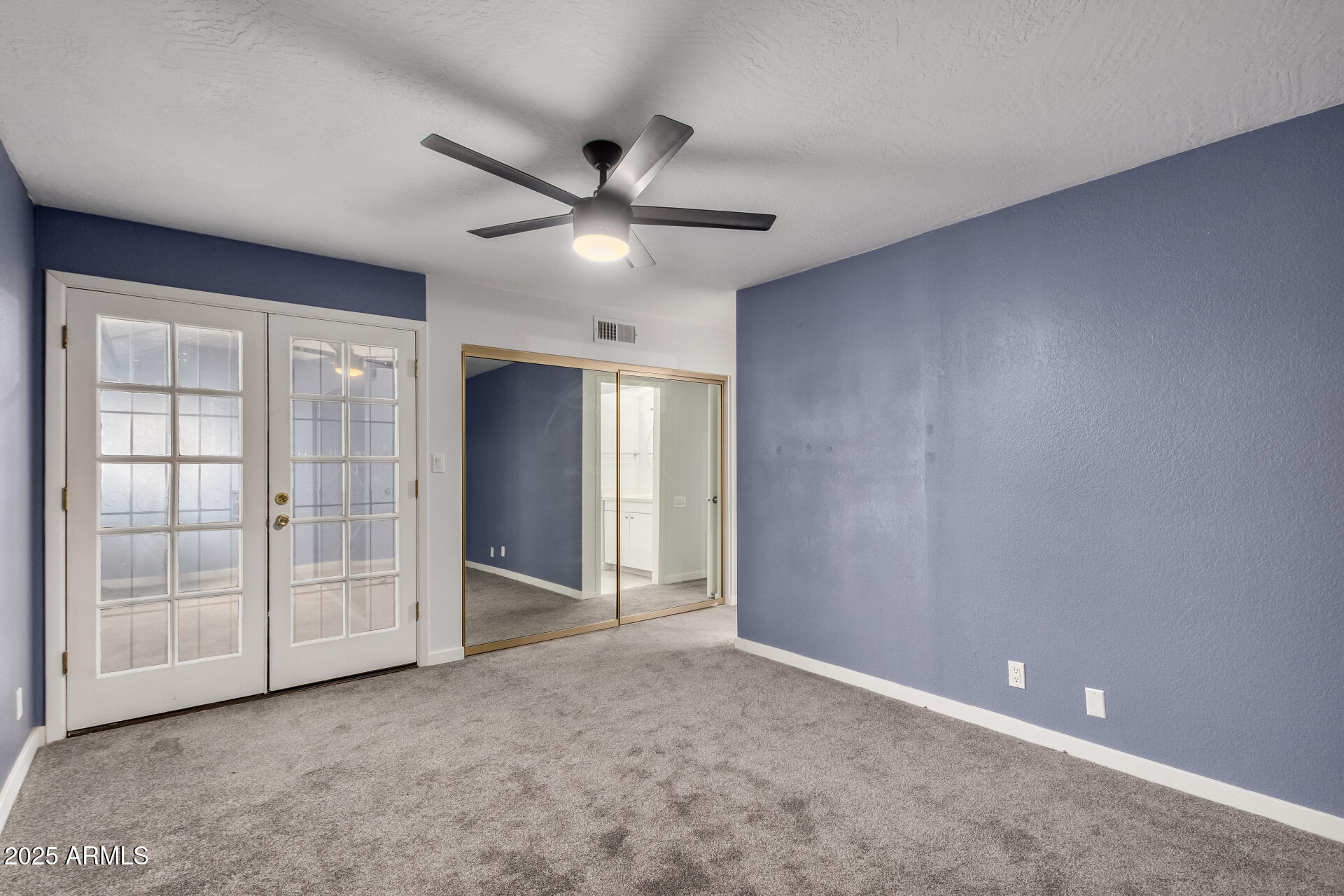 716 West Boxelder Place Chandler, AZ 85225 - Photo 8 of 15 an empty room with fan and windows