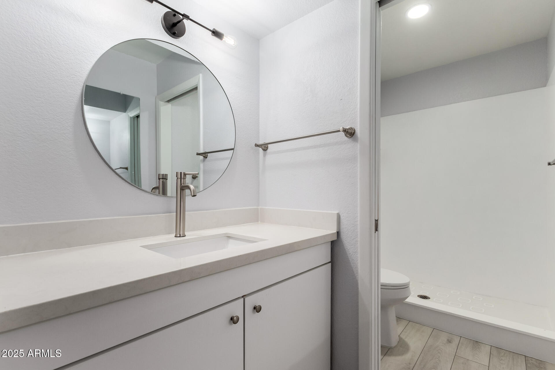 716 West Boxelder Place Chandler, AZ 85225 - Photo 9 of 15 a bathroom with a sink a toilet and a mirror