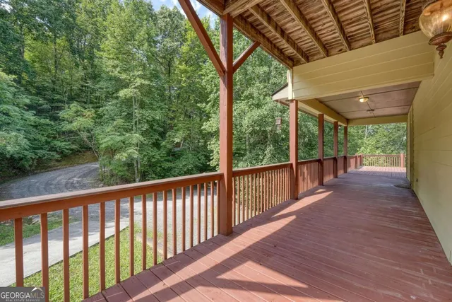 a view of a balcony with wooden floor