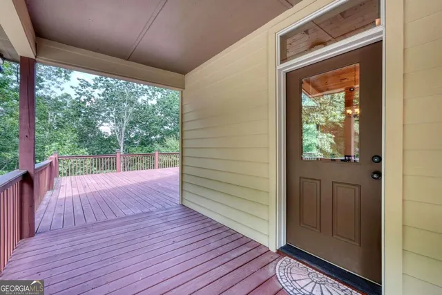 a view of a porch with wooden floor