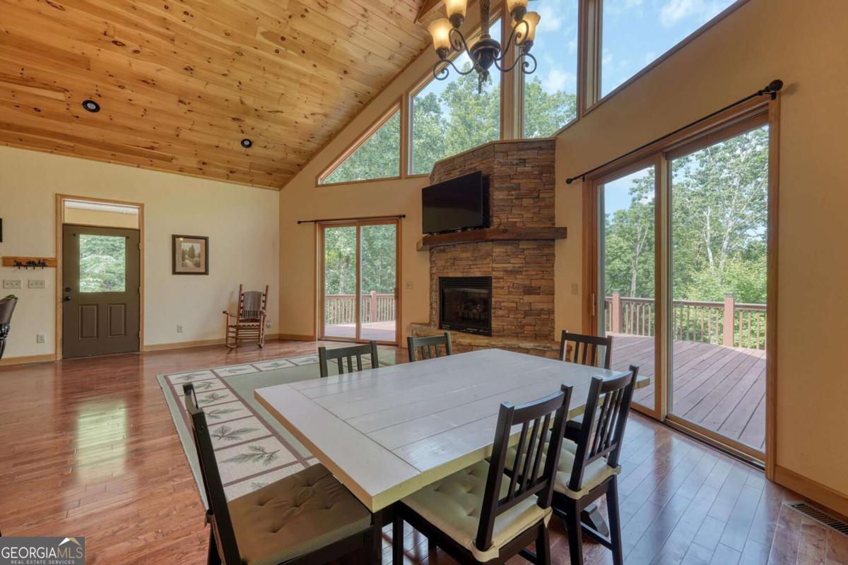 235 Oak Rdg Estate Murphy, NC 28906 - Photo 14 of 54 a view of a dining room with furniture window and wooden floor