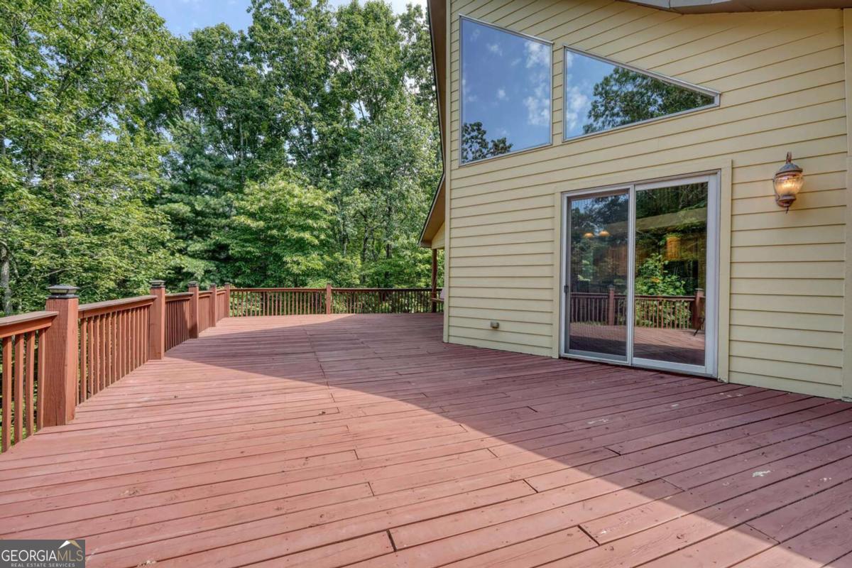 235 Oak Rdg Estate Murphy, NC 28906 - Photo 15 of 54 a view of backyard with small cabin and wooden fencing