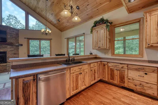 a kitchen with wooden cabinets and a sink