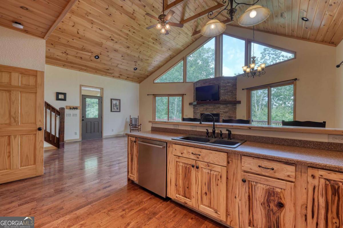235 Oak Rdg Estate Murphy, NC 28906 - Photo 20 of 54 a kitchen with wooden cabinets and a sink