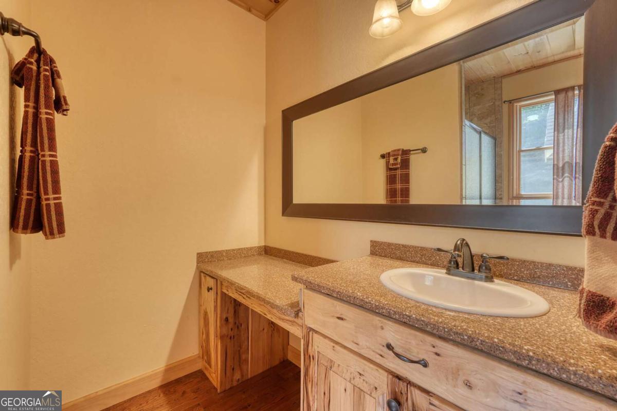 235 Oak Rdg Estate Murphy, NC 28906 - Photo 25 of 54 a bathroom with a sink and a mirror