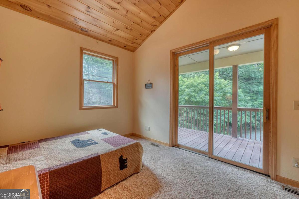 235 Oak Rdg Estate Murphy, NC 28906 - Photo 30 of 54 a bedroom with a bed and a window