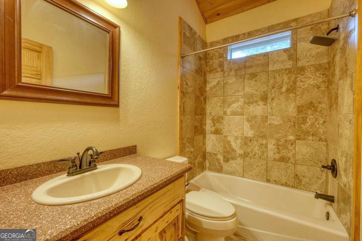235 Oak Rdg Estate Murphy, NC 28906 - Photo 32 of 54 a bathroom with a granite countertop sink toilet and shower