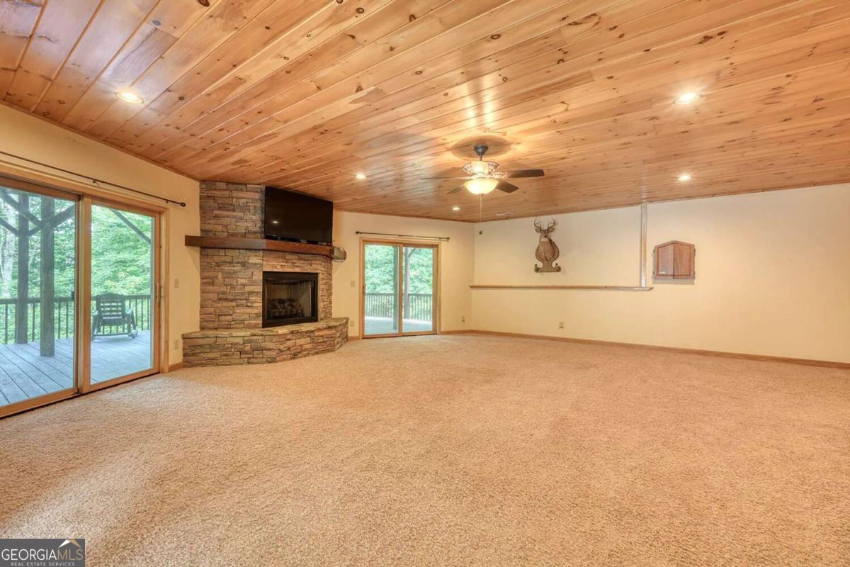 235 Oak Rdg Estate Murphy, NC 28906 - Photo 37 of 54 a view of empty room with a fireplace and windows