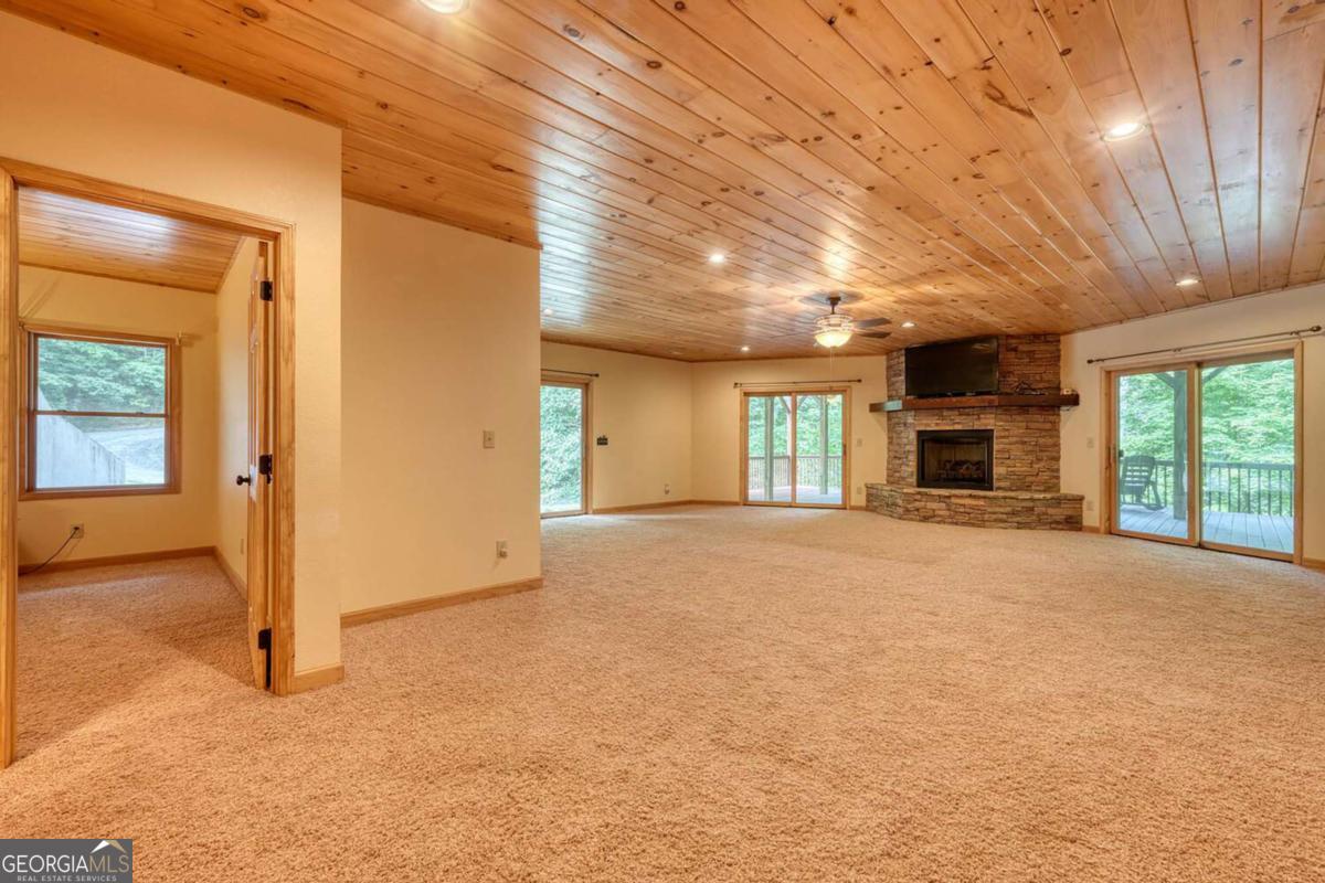 235 Oak Rdg Estate Murphy, NC 28906 - Photo 39 of 54 an empty room with windows and fireplace