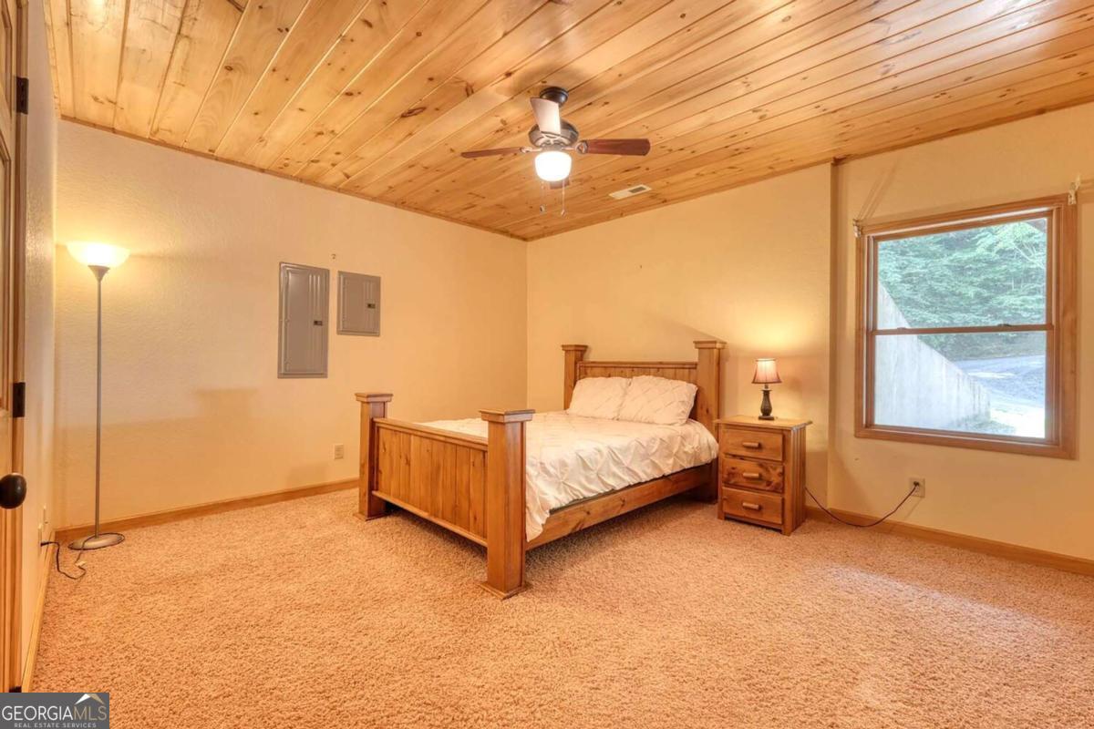 235 Oak Rdg Estate Murphy, NC 28906 - Photo 42 of 54 a bedroom with a bed and a window