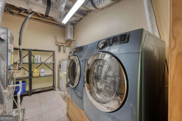 a view of a house with a yard and furniture