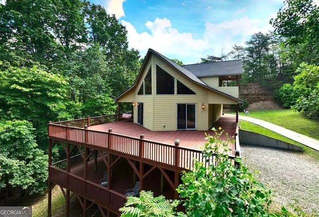 a view of a city with lush green forest