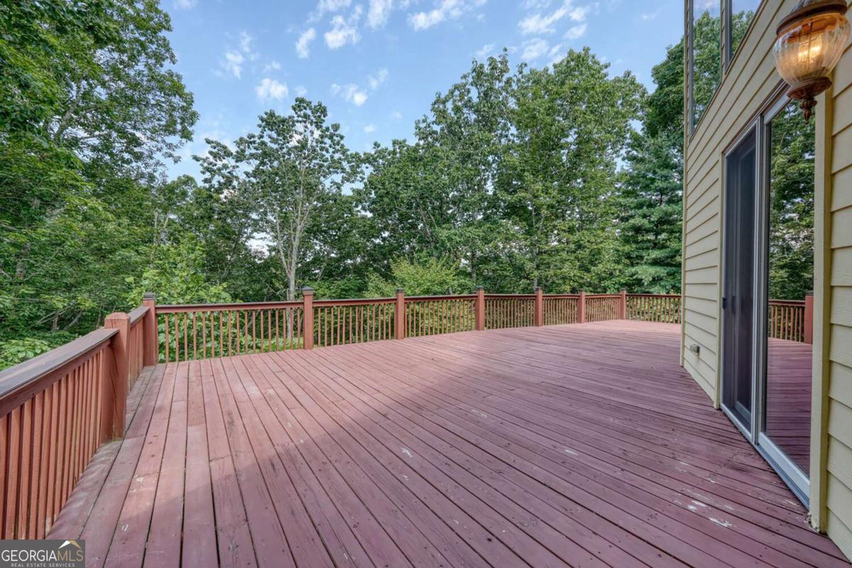 235 Oak Rdg Estate Murphy, NC 28906 - Photo 49 of 54 a view of backyard with a deck and wooden floor