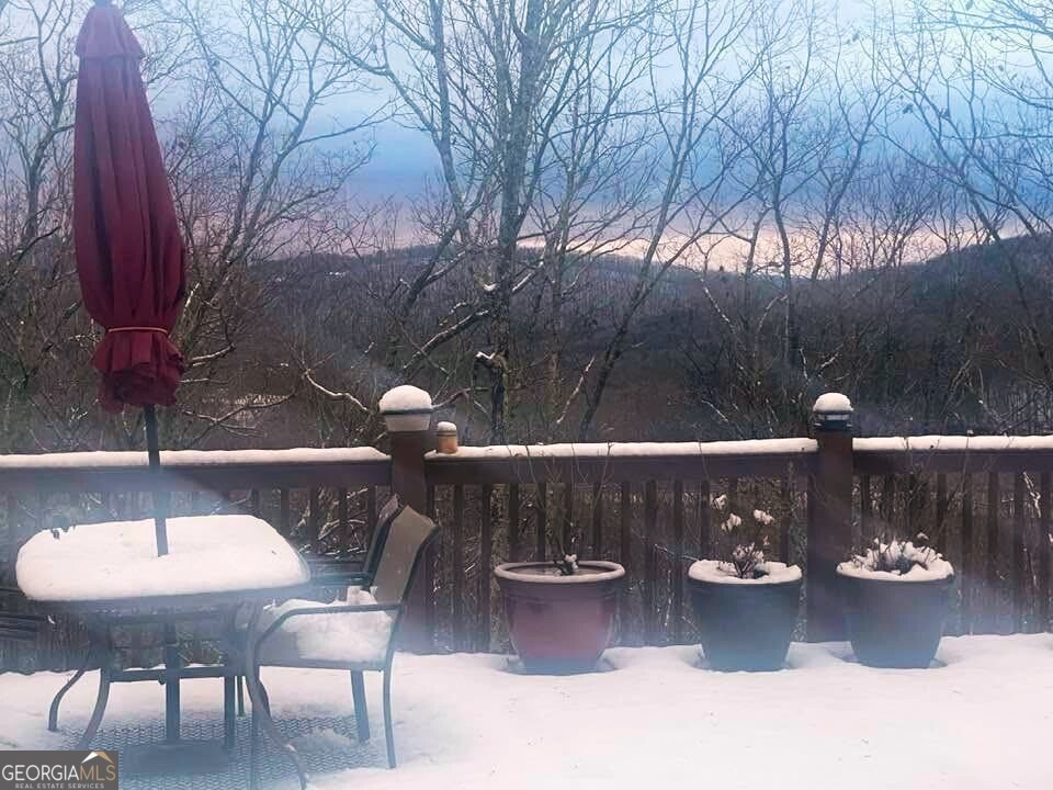 235 Oak Rdg Estate Murphy, NC 28906 - Photo 54 of 54 a view of a balcony with chairs and a potted plant