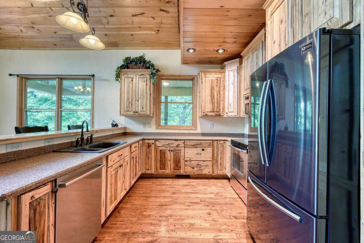 235 Oak Rdg Estate Murphy, NC 28906 - Photo 6 of 54 a kitchen with stainless steel appliances granite countertop a refrigerator and a sink