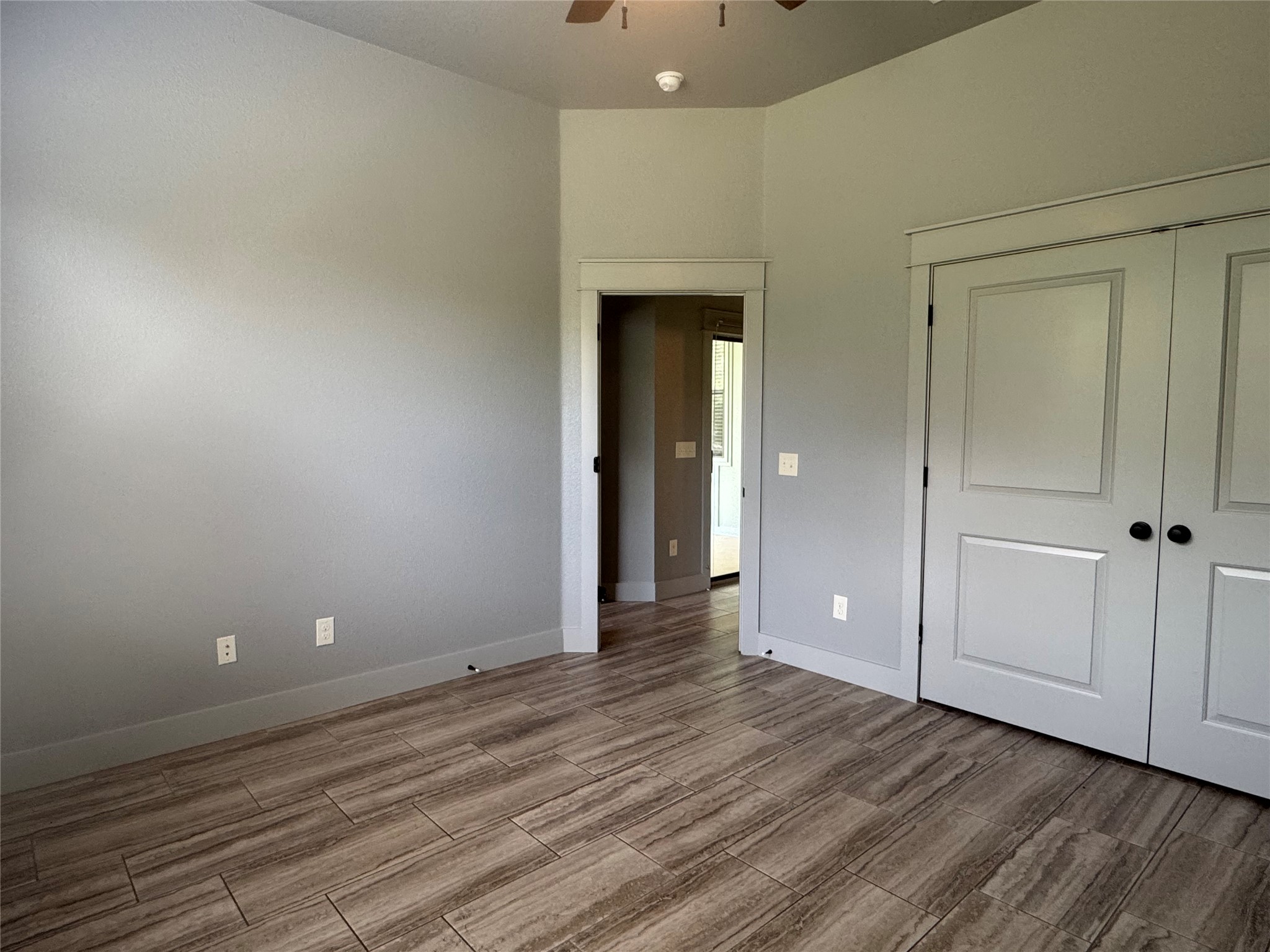 290 Hugo Road, Unit B San Marcos, TX 78666 - Photo 13 of 22 an empty room with wooden floor and closet