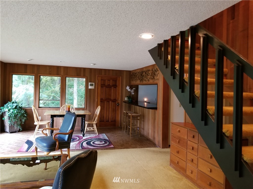 230 Wilcox Road Salkum, WA 98582 - Photo 5 of 18 a view of a livingroom with furniture wooden floor and a floor to ceiling window