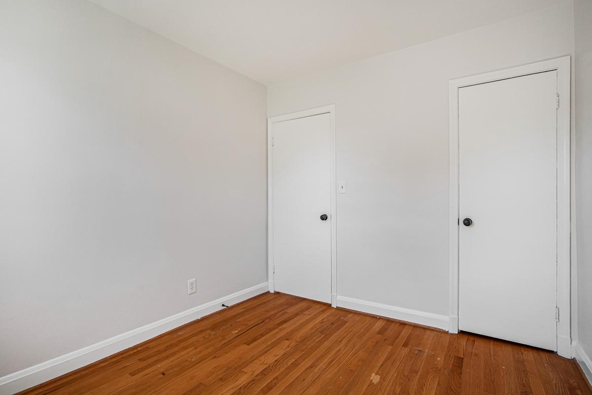 1016 Winsford Road Towson, MD 21204 - Photo 27 of 42 a view of an empty room with wooden floor
