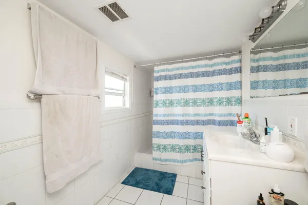 a bathroom with a sink and a shower