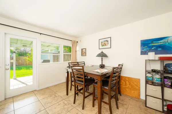 a view of a dining room with furniture and a window