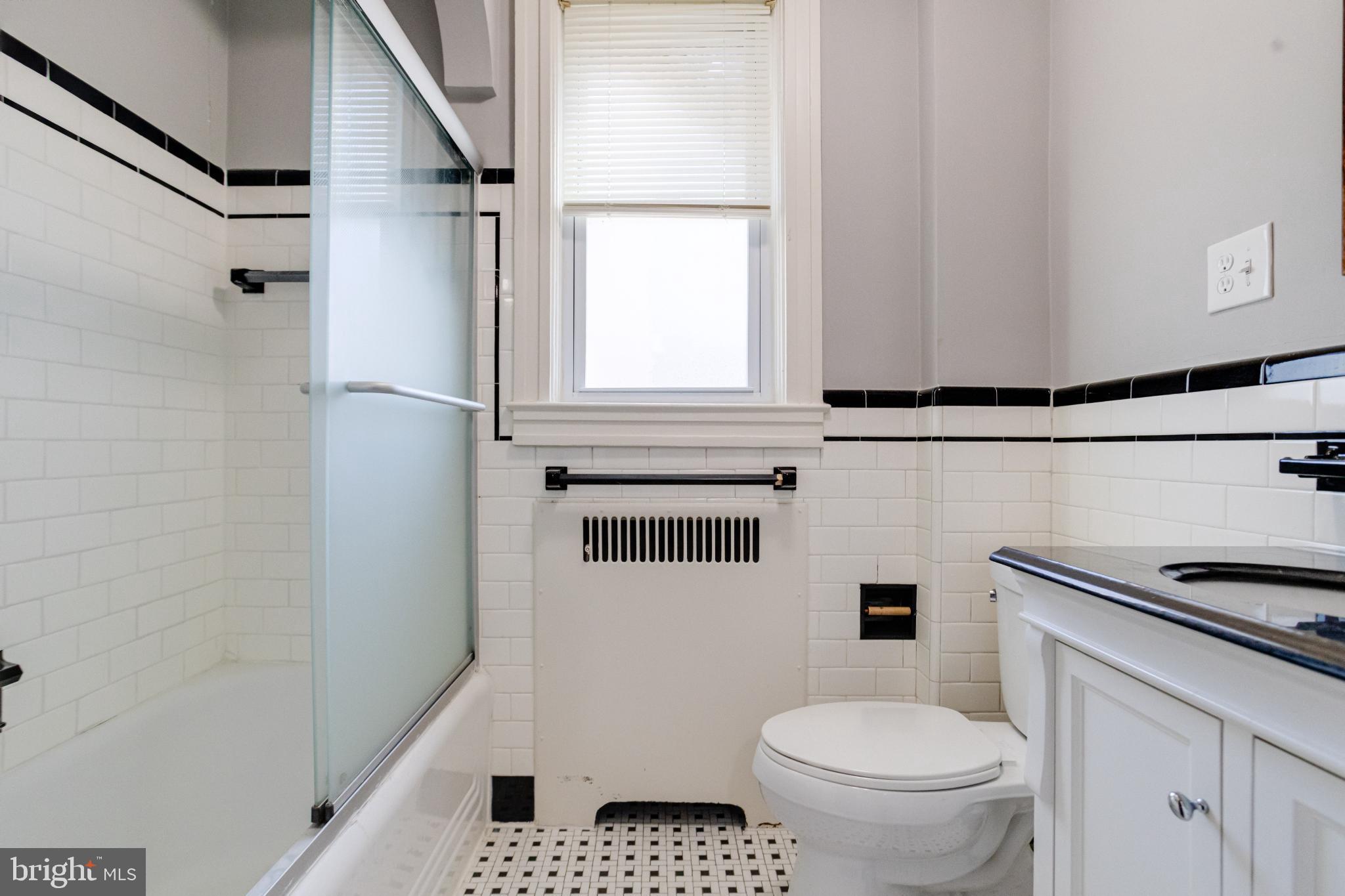 4114 Moravia Road Baltimore, MD 21206 - Photo 35 of 50 Chic bathroom with classic tile accents.