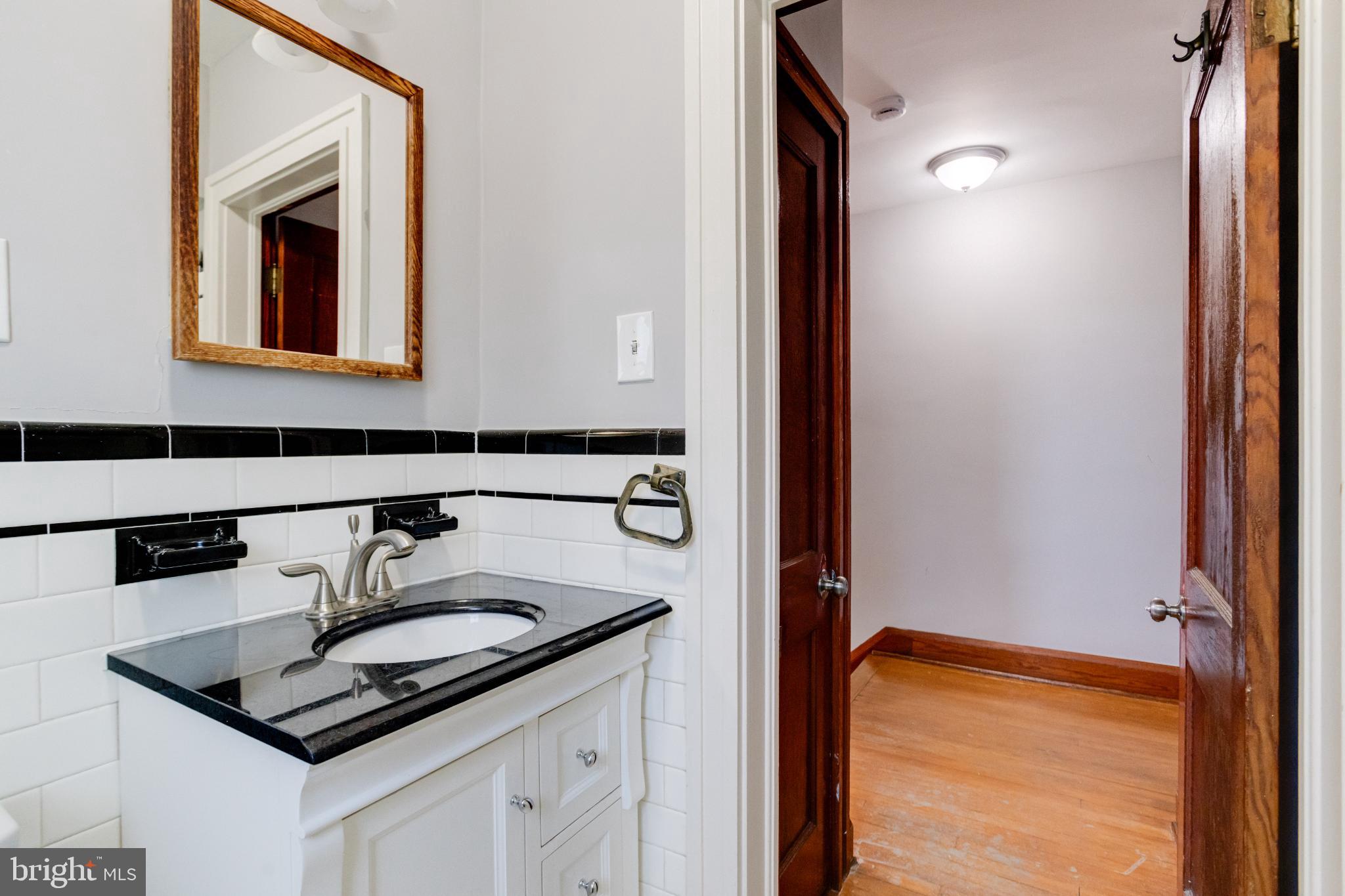 4114 Moravia Road Baltimore, MD 21206 - Photo 36 of 50 Charming bathroom with classic elegance.
