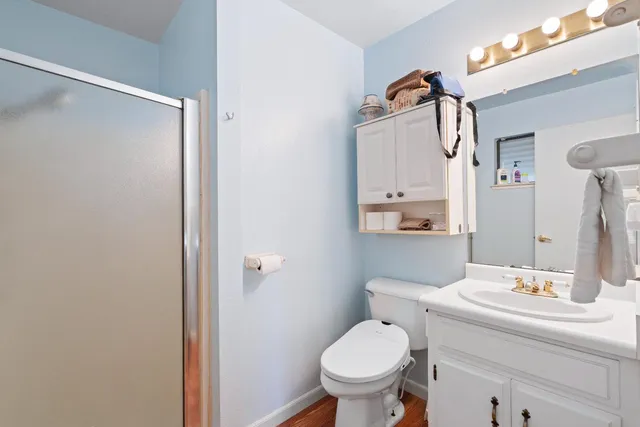 a bathroom with a sink toilet and shower