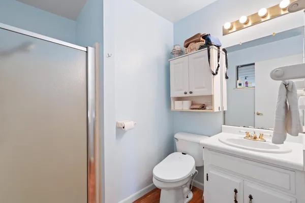 a bathroom with a sink toilet and shower