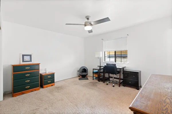 a view of a workspace with furniture