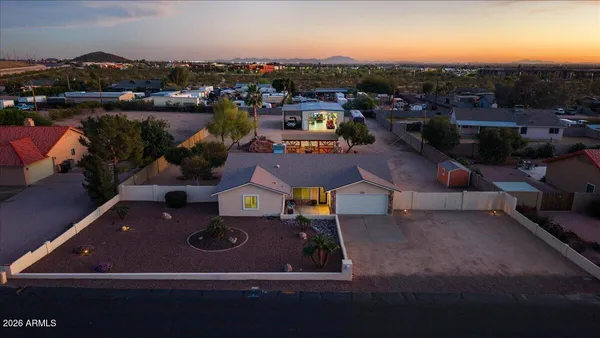 an aerial view of a house with a lake view
