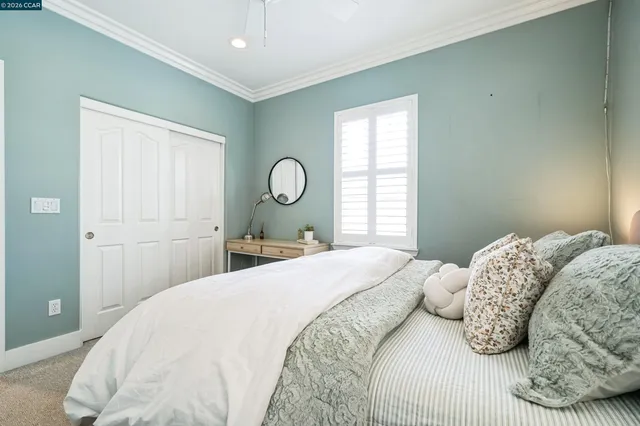 a bedroom with a bed and window