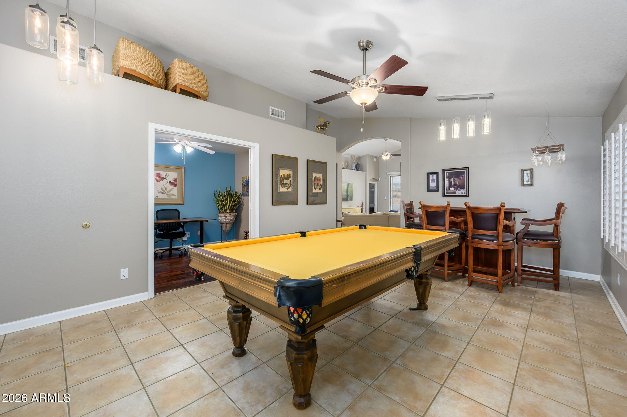 3136 East Roveen Avenue Phoenix, AZ 85032 - Photo 6 of 38 a living room with pool table and a chandelier