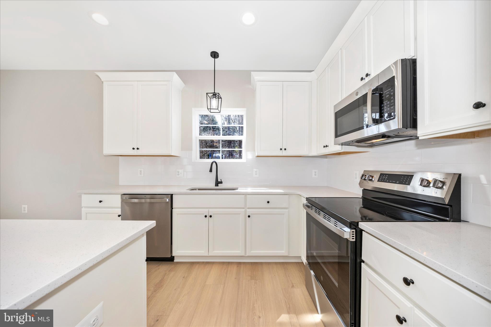 4 Fir Trail Fairfield, PA 17320 - Photo 15 of 53 a kitchen with stainless steel appliances a stove a sink and a microwave