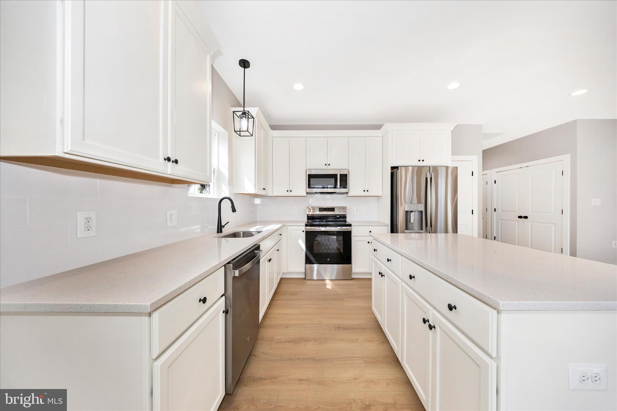 4 Fir Trail Fairfield, PA 17320 - Photo 16 of 53 a kitchen with white cabinets sink and stainless steel appliances