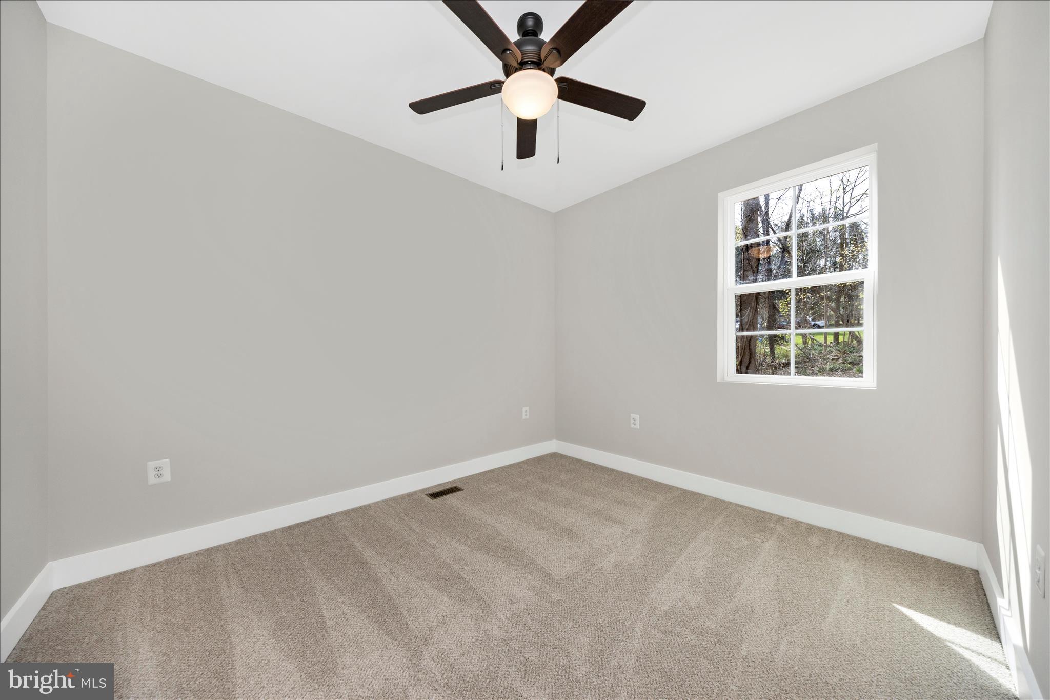 4 Fir Trail Fairfield, PA 17320 - Photo 29 of 53 an empty room with a window and a fan