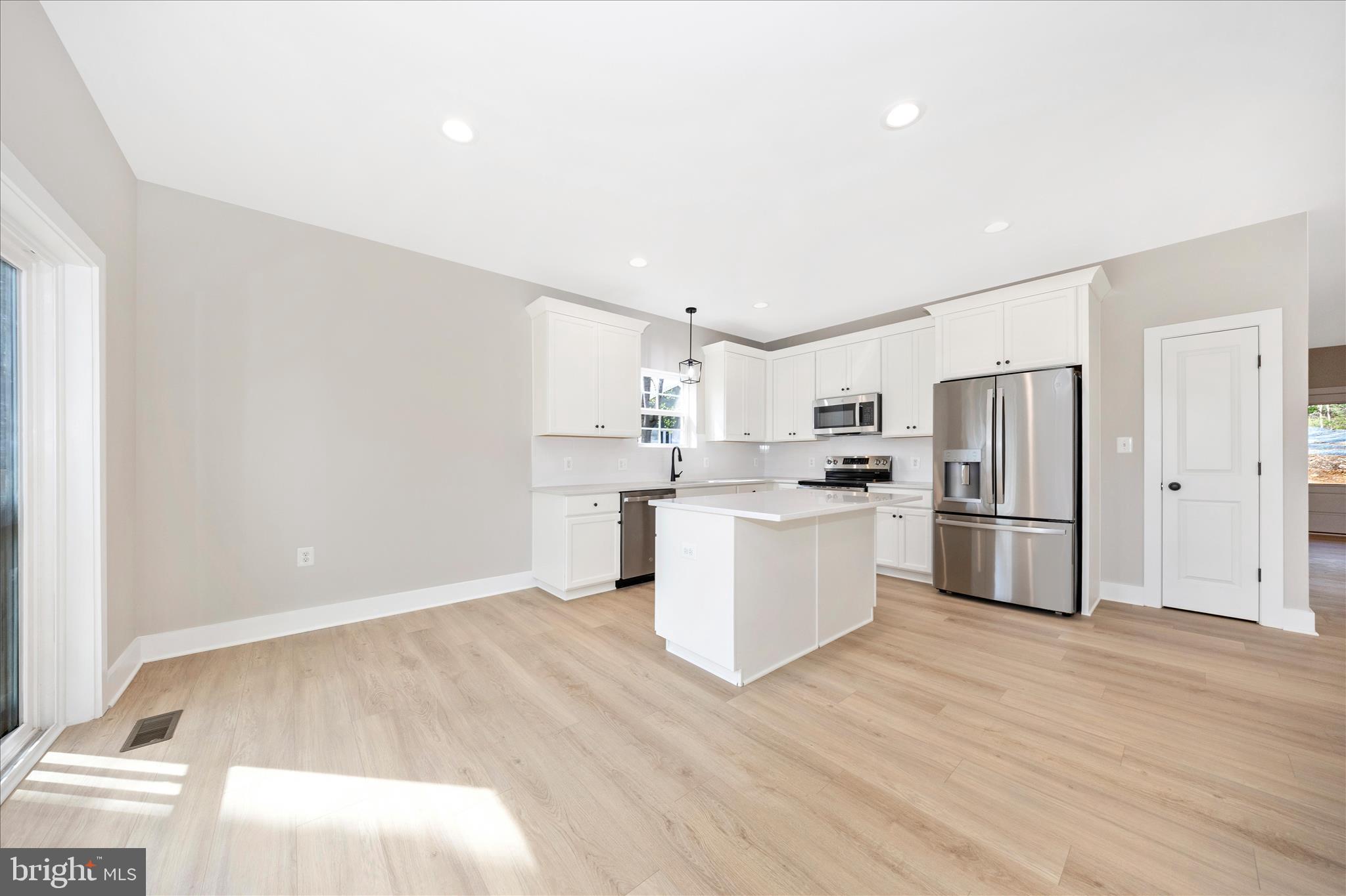 4 Fir Trail Fairfield, PA 17320 - Photo 10 of 53 a kitchen with stainless steel appliances a refrigerator sink and white cabinets
